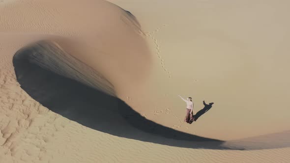 Woman Creating Futuristic World of Future in AR Googles at Sand Dunes  Aerial