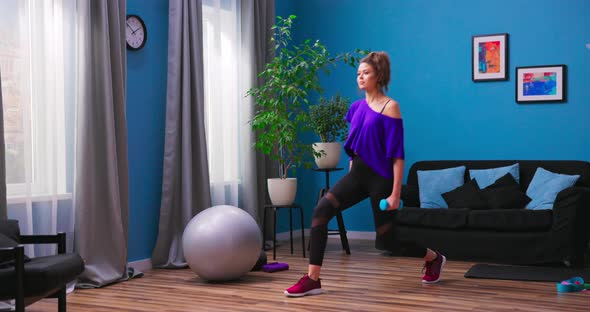 Profile View of Sporty Girl Doing Lunges Workingout Leg Muscles and Glutes in Loft Interior