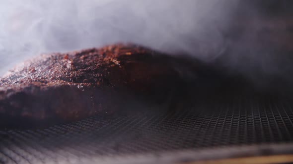 smoking meat in a smokehouse