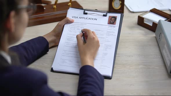 Female Embassy Worker Checking Visa Application Office, Immigration Regulation