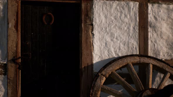 Old Wood Wheel and Black Door at White House