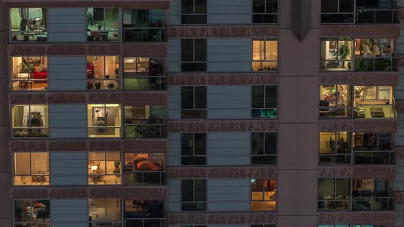 Windows in Recidential Building Exterior in the Late Night with Interior Lights on Timelapse