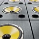 Moving Diagonal Over Audio Speakers with Yellow Membranes Playing Modern Music - VideoHive Item for Sale