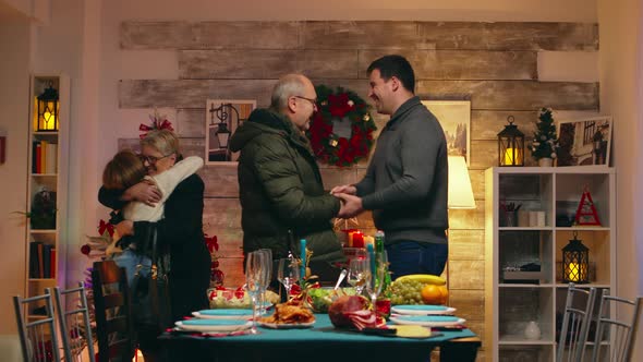 Young Man Shaking Hands with His Father in Law