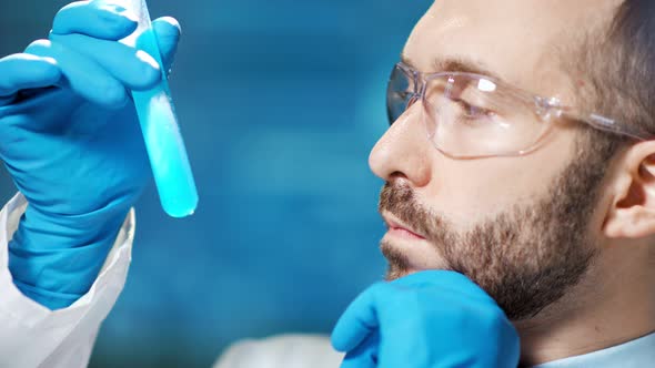 Closeup Face of Male Technician Conducting Examine in Modern Laboratory