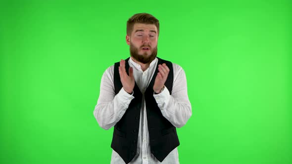 Man Claps His Hands with Dissatisfaction. Green Screen