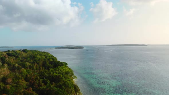 Aerial: uncontaminated coastline tropical beach caribbean sea at Pasir Panjang K