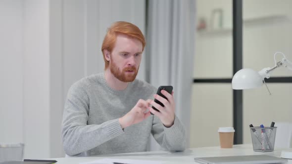 Beard Redhead Man Reacting Loss While Using Smartphone