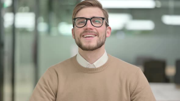 Young Creative Man Showing Shaking Head As Yes Sign