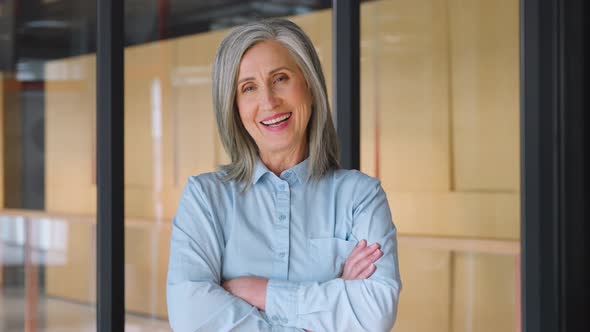 Portrait of Smiling Confident 60s Grayhaired Mature Woman