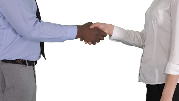 Hands of businessman and businesswoman handshaking on white