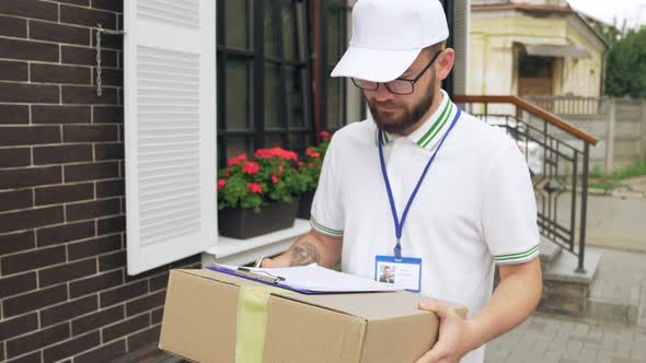 Male Courier with Name Tag Delivering Parcel.