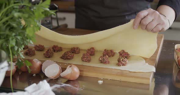 Woman preparing home made Maultaschen