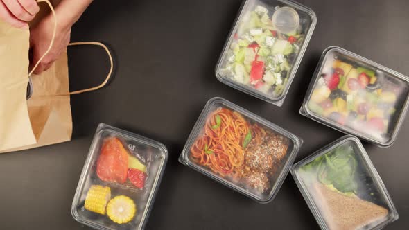 Packaging Take Away Meals Into Paper Bag Top View Food Delivery in Disposable Containers Balanced