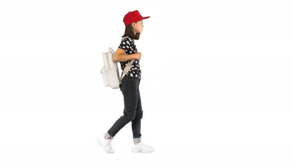 Asian Schoolgirl with Backpack Walking on White Background