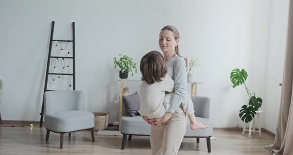 Caring Mom Carrying Little Cute Son Hugging Holding By Hands Motherhood Feeling Love Tenderness