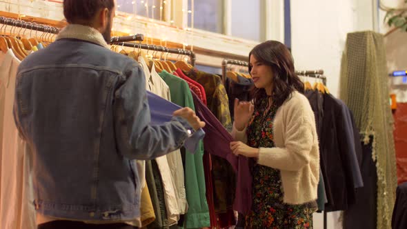 Couple Choosing Clothes at Vintage Clothing Store 8