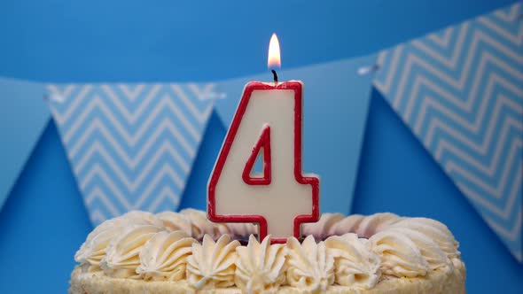 Happy birthday. 4 year old, cupcake, birthday cake with candles on a blue background.close-up