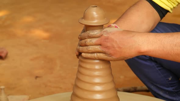 Potter at Work Makes Ceramic Dishes