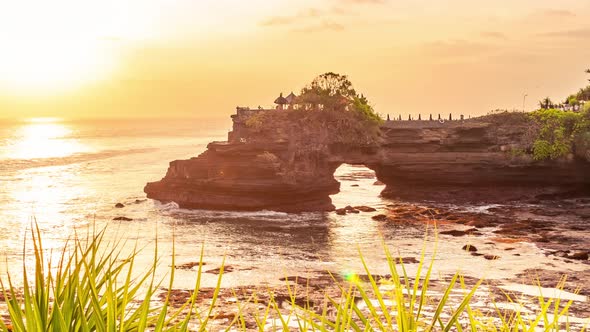 Sunset at Batu Bolong and Tanah Lot Temple in Bali, Indonesia. Timelapse 