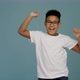 Portrait of cheerful little boy with curly hair in T-shirt smiling funny and dancing joyfully - VideoHive Item for Sale