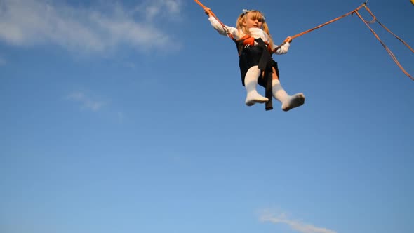 Little Girls Jumping on a Trampoline