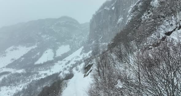 Aerial view of beautiful snowy mountains in Pasanauri, Georgia