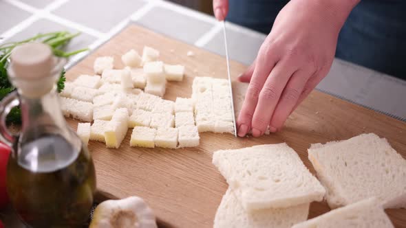 Making Caesar Salad Croutons By Slicing Toast Bread