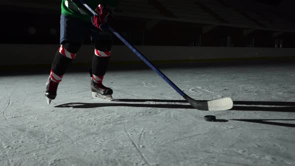 Low Angle Hockey Forward Player Masterfully Dribbles Hitting Puck with Stick Scores Goal