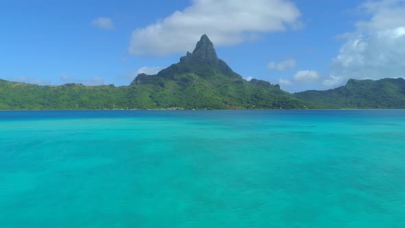 Aerial drone view of the lagoon and Mount Otemanu at Bora Bora tropical island.