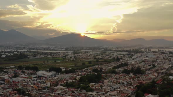 AERIAL: Zamora, Michoacan, Mexico, Mountains, Sunset (Flying Forward)