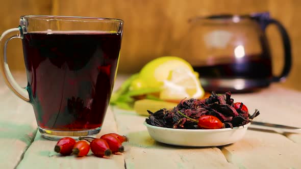 Red Tea In A Transparent Mug On Wooden Boards, Rosehip Tincture, Homeopathic Medicinal Tea