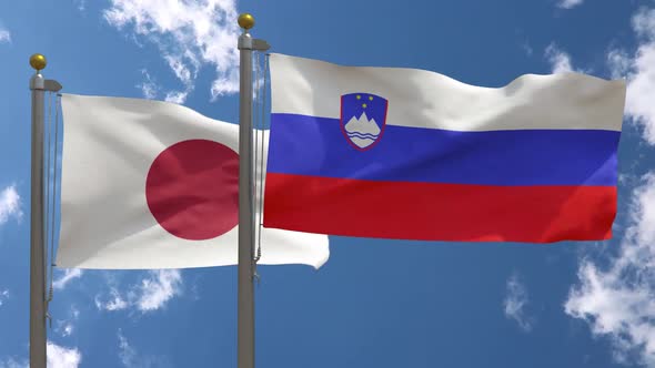 Japan Flag Vs Slovenia Flag On Flagpole