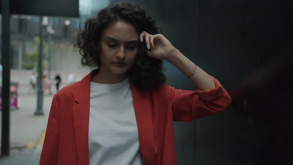 Slow Motion Portrait of Serious Young Woman Watching Crime Scene Illuminated with Police Lights