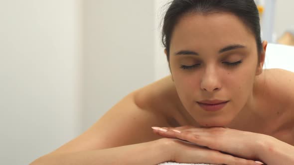 Girl Relaxes on the Massage Table