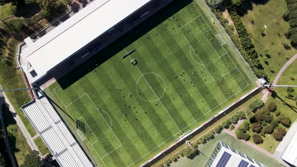 Aerial view of people playing football in Setubal, Portugal.