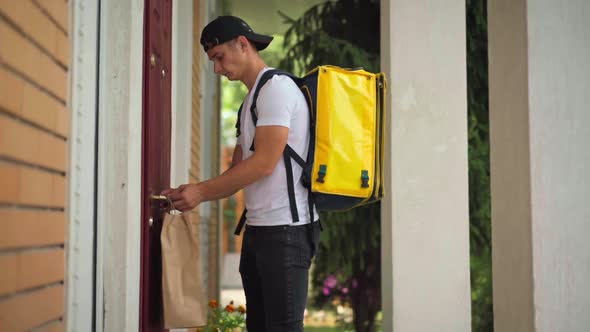 Courier Hanging Delivery on Door Handle Knocking Walking Away