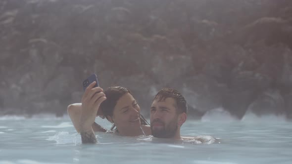 Couple Posing For Selfie In Lagoon Geothermal Spa