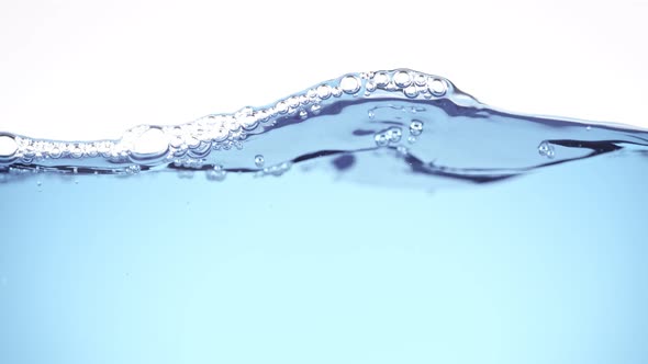 Super Slow Motion Shot of Clear Waving Water With Bubbles Background at 1000 Fps