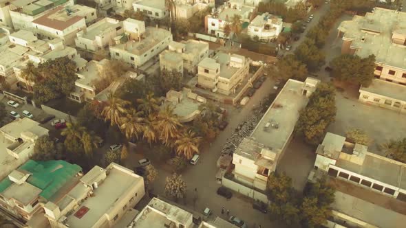 Aerial View Over Residential Road With Traffic In Karachi, Pakistan. Follow Shot