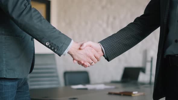 Close Up View of Business Partnership Handshake Concept. Footage of Two Businessman Handshaking