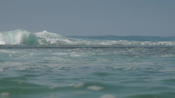 Breathtaking Boundless Turquoise Ocean with Large White Wave