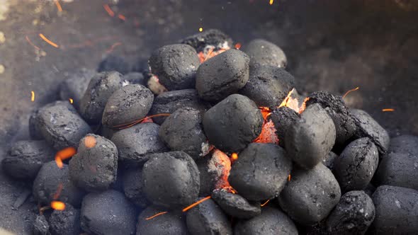 Closeup Of Glowing Coal In Metal Grill On Summer Day