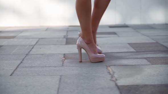 Closeup Unrecognizable Sexy Female Feet in High Heels Walking Along City Street