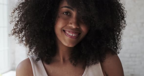 A Happy Cheerful Young Mixedrace Woman Dancing Alone