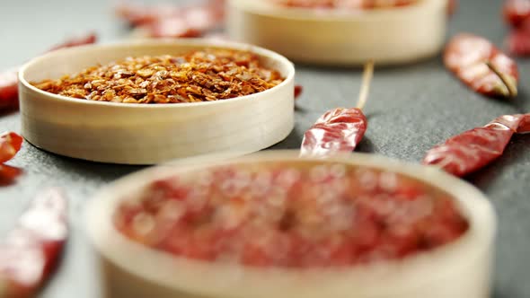 Dried red chili pepper and crushed red pepper in bowl 4k