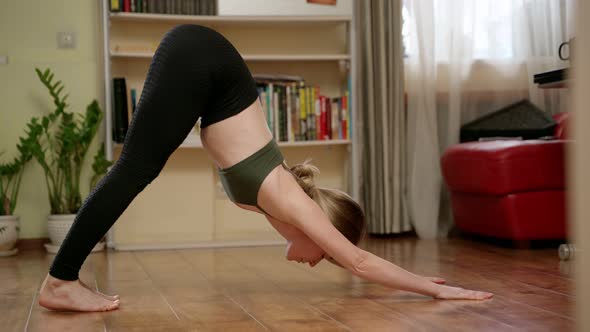 Flexible woman doing yoga asanas