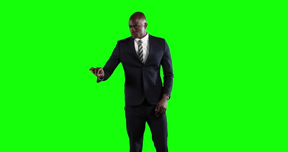 an African American man in suit in green background