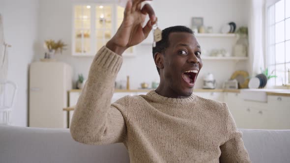 Emotional African American Man Shows Key to New Apartment