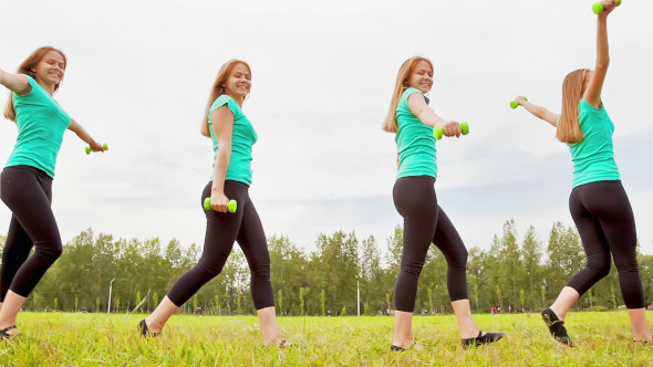 Young Woman With Dumbbells alt